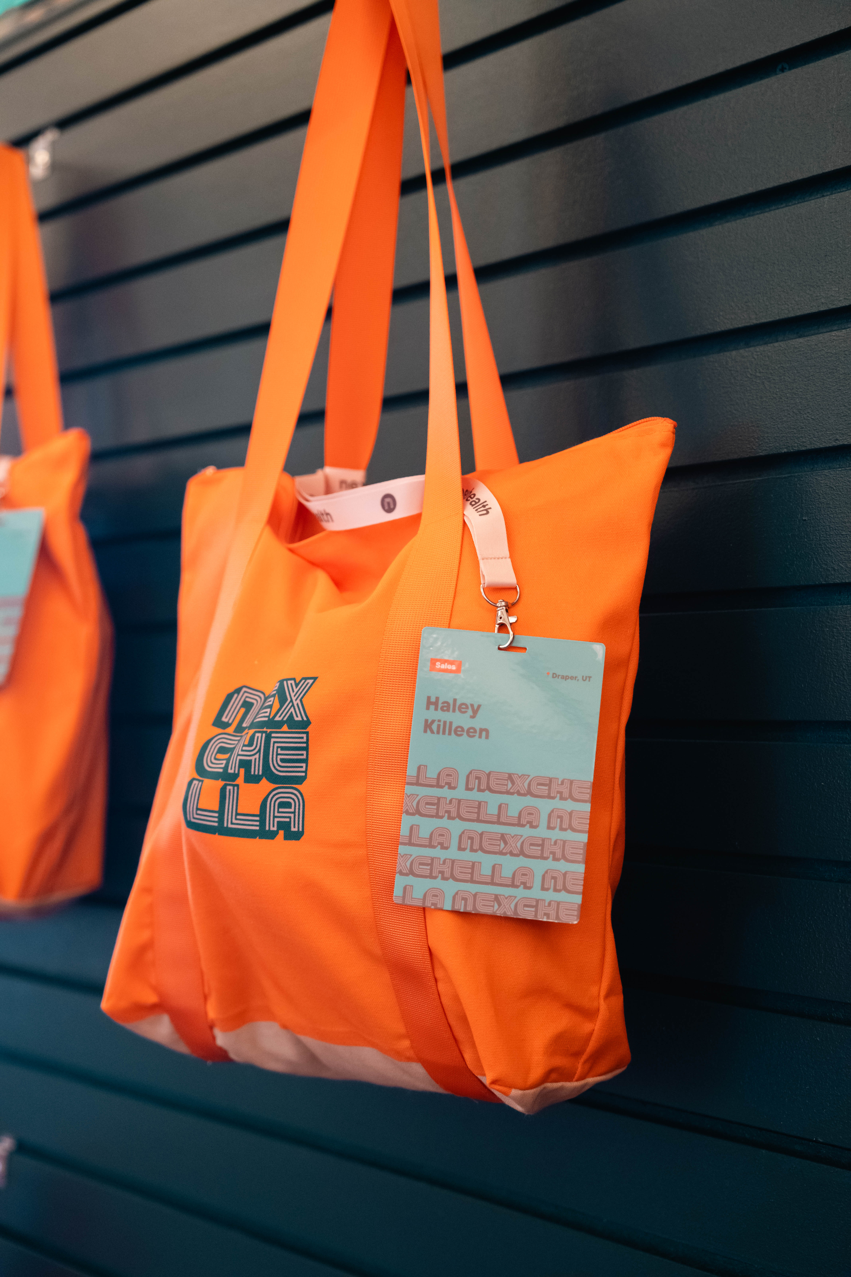 two people sitting on a ledge talking
